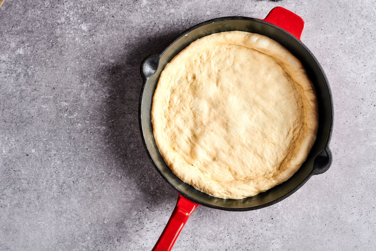 pizza dough in cast iron.